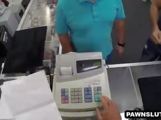 Busty brunette tries to sell her laptop at the pawn shop